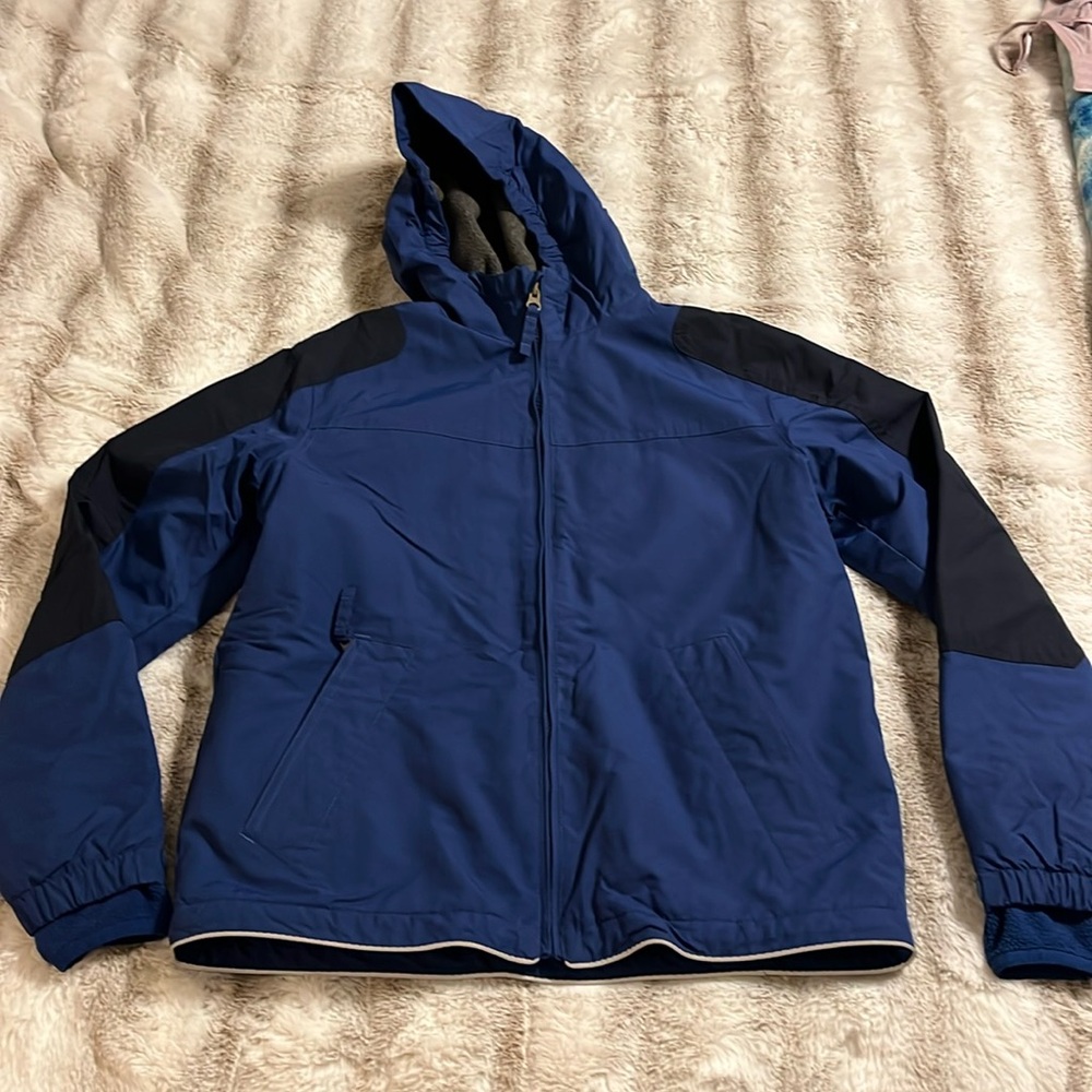 Land’s End kids size 10/12 blue/navy two tone hooded jacket with fleece lining.